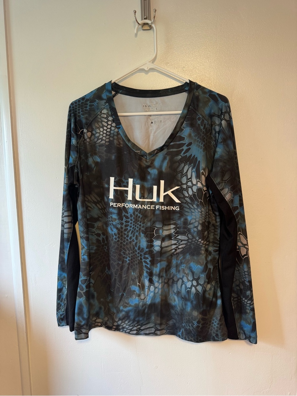 Huk Women's V-Neck Long Sleeve Performance Top in Blue and Black